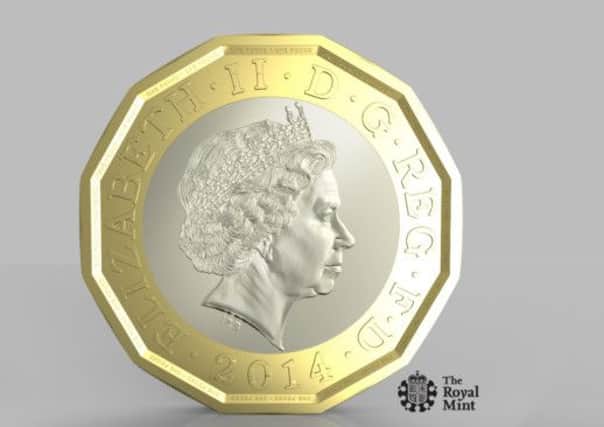 The new one pound coin, which will have the same shape as the 12-sided pre-decimal threepenny bit.   .