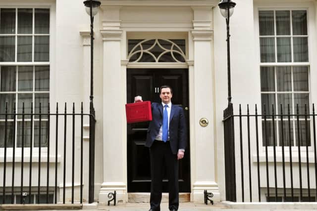 George Osborne outside 11 Downing Street before heading to the House of Commons to deliver his annual Budget statement.