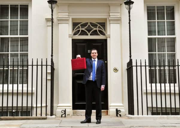 George Osborne outside 11 Downing Street before heading to the House of Commons to deliver his annual Budget statement.