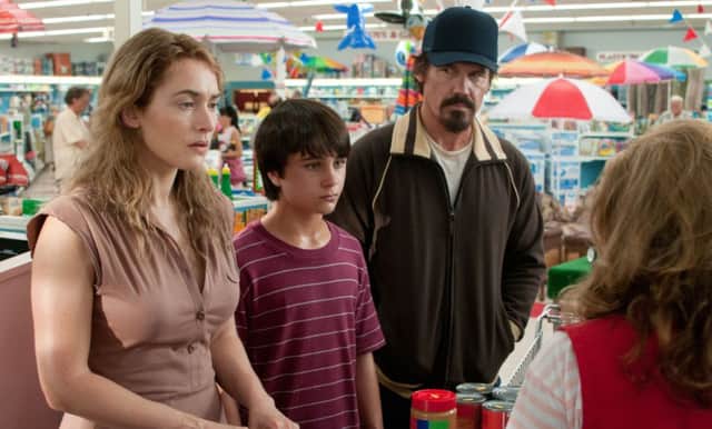 Kate Winslet as Adele, Josh Brolin as Frank and Gattlin Griffith as Henry, in Labor Day