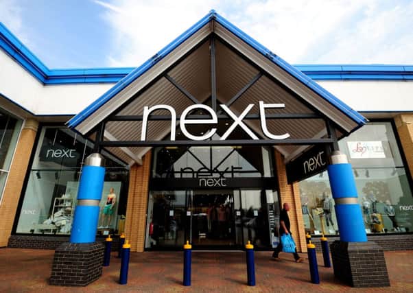 Next toasted a "great year" for the group today as a £695 million annual profits haul put it on course to overtake rival Marks & Spencer for the first time in its history.