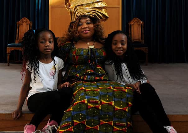 Mammy Davis a refugee from Liberia, with two of her five children in Sheffield