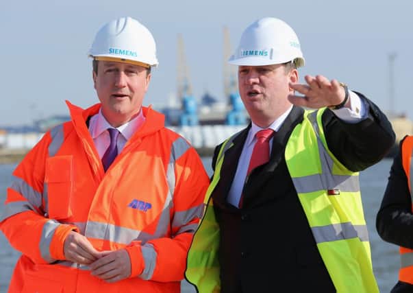 David Cameron and Michael Suess Chief Executive Officer of Siemens Energy, tour King George Dock in Hull