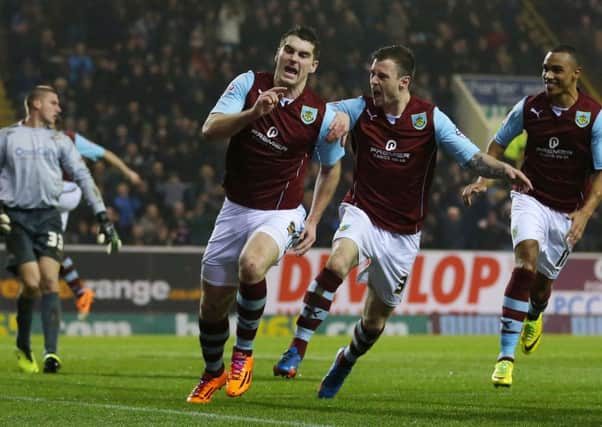 Burnley's Sam Vokes (centre) celebrates scoring during the Sky Bet Championship match at Turf Moor, Burnley.