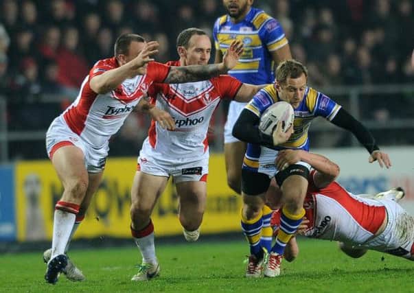 Leeds Rhinos' Rob Burrow finds his path blocked at Langtree Park. Picture: Steve Riding.