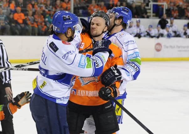 Ashley Tait experiences the frustration of defeat for Sheffield Steelers against his current club Coventry Blaze in the first round of the play-offs last year. Picture Dean Woolley.