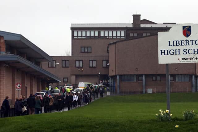 Police at Liberton High School in Edinburgh where a pupil died after a wall inside the school collapsed onto her.