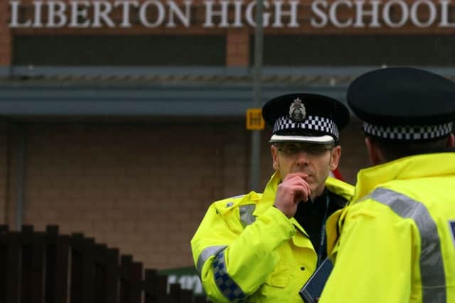 Police at Liberton High School in Edinburgh where a pupil died after a wall inside the school collapsed onto her.