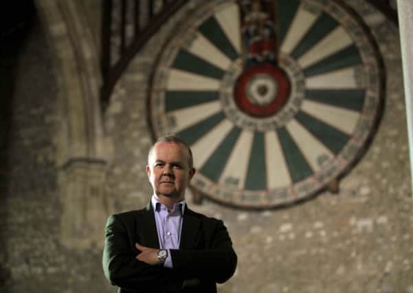 Ian Hislop with King Arthur's legendary Round Table in Winchester Great Hall.