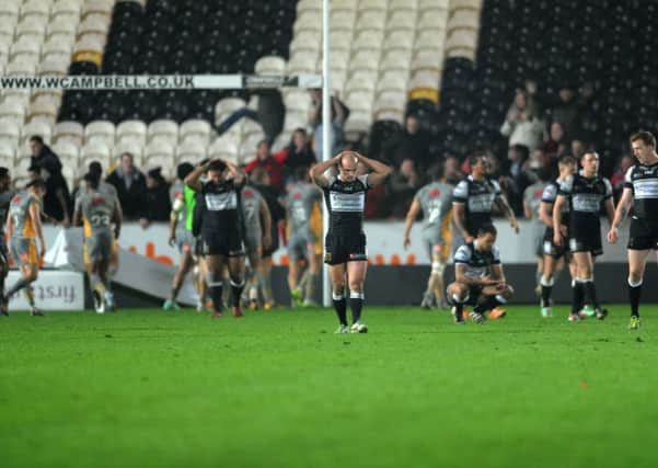 Hull FC's dejected players after defeat to Salford. Picture Jonathan Gawthorpe.