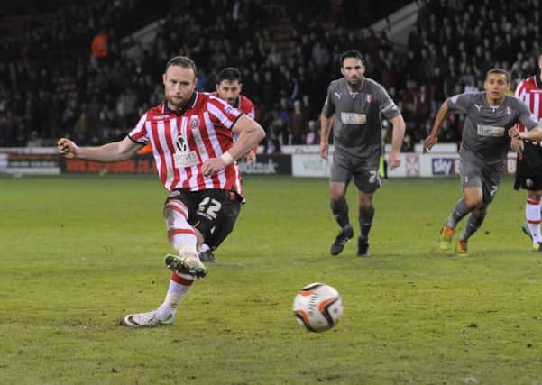 Ben Davies slots home Sheffield United's winning goal from the penalty spot.