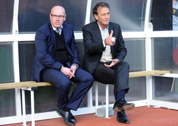 Massimo Cellino sits with manager Brian McDermott before the match at Watford on Tuesday night.