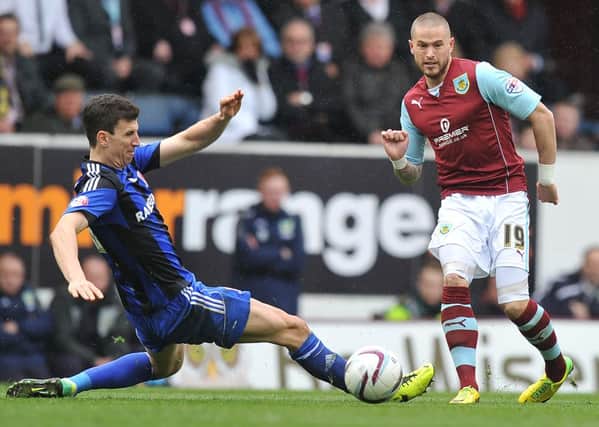 Burnley's Michael Kightly gets the ball past Middlesbrough's Daniel Ayala.