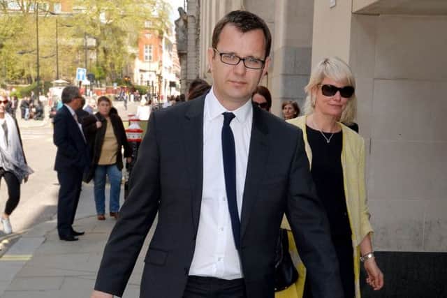Former News of the World Editor Andy Coulson, leaves the Old Bailey, central London with his wife Eliose (right) a discreet distance behind