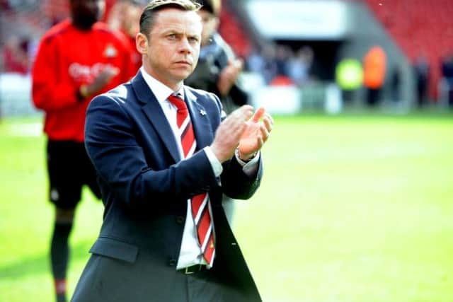 Paul Dickov applauds the home fans at the end of the Redaing match.