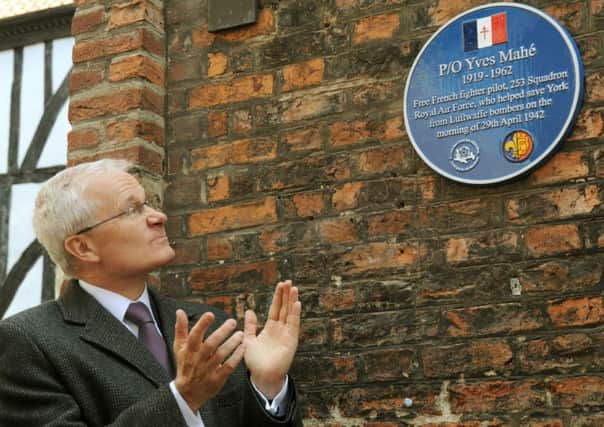 French Ambassador Bernard Emie unveils a plaque for Free French Fighter Pilot Yves Mahe in the centre of York