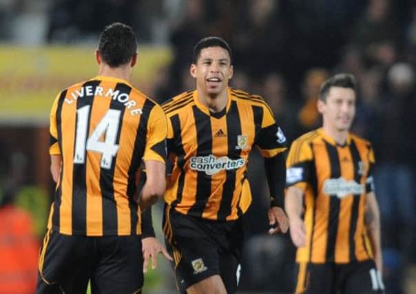 Hull City's Curtis Davies (centre) celebrates with Jake Livemore after scoring his side's first goal during the FA Cup Fifth Round replay at the KC Stadium, Hull.