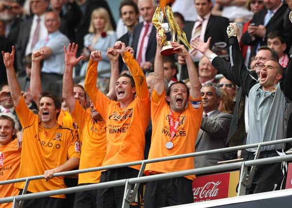 Hull City's Ian Ashbee lifts the Championship play off trophy after the Coca-Cola Championship Play Off Final at Wembley Stadium, London.