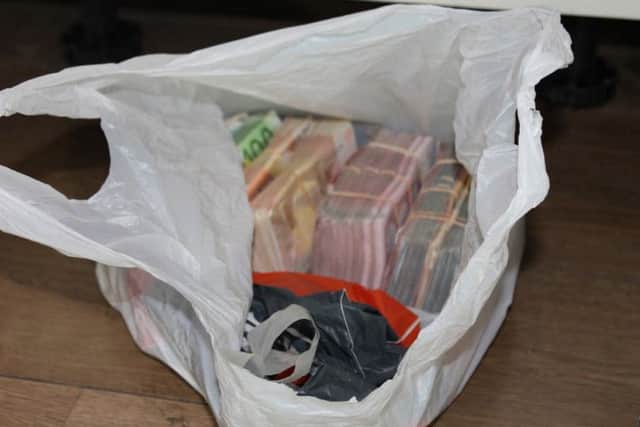Cash and goods found by police in the case of Craig Allen.