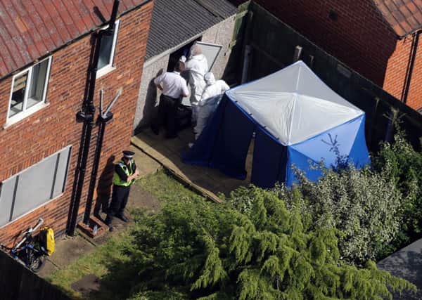 Police forensic officers in the back garden of a house on Burnholme Grove in York. Picture: Ross Parry Agency