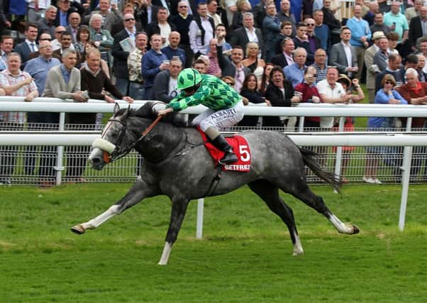 The Grey Gatsby, ridden by Ryan Moore, on its way to winning the Betfred Dante Stakes.