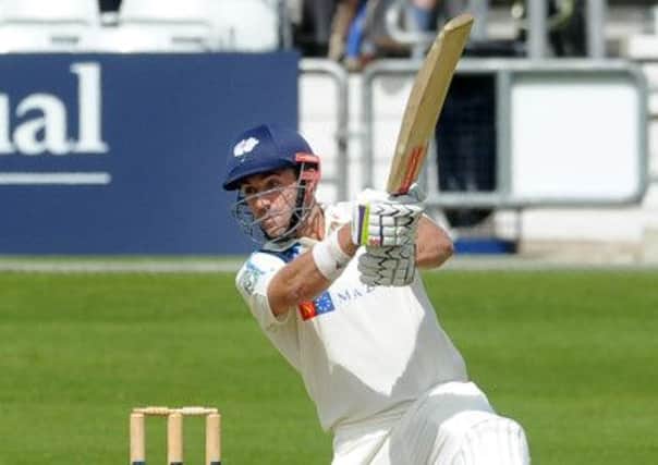 Liam Plunkrett goes on the attack during his innings of 86 against Warwickshire.