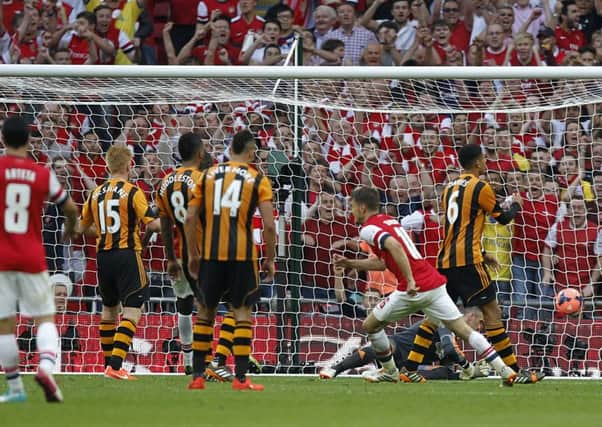 Arsenal's Aaron Ramsey scores his side's third goal. PIC:  PA