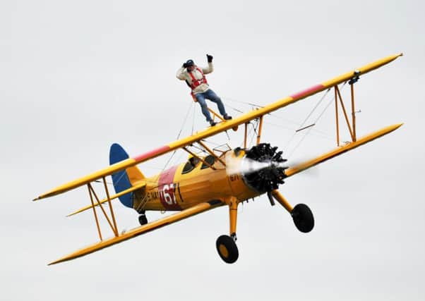 William Hague's 83 year old father Nigel performing a wing walk at Breighton Airfield to raise cash for the NSPCC.
 Picture by Gerard Binks.