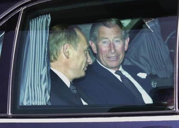 Vladimir Putin with the Prince of Wales.