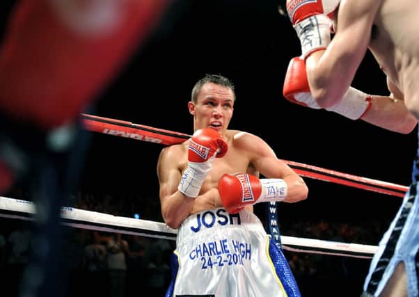 Josh Warrington on his way to retaining his commonwealth featherweight title, and winning the British title on points, against Martin Lindsay. (Picture: Jonathan Gawthorpe)