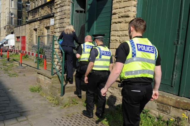 Police officers  during a raid by the Medicines Regulation Agency at a warehouse in Keighley.  Pictures by Bruce Rollinson