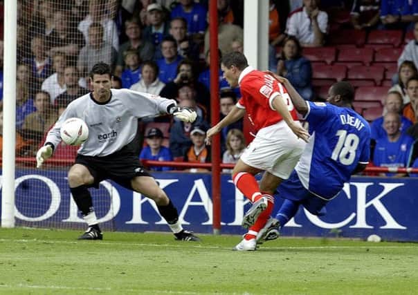 Rotherham goalkeeper Mike Pollitt is beaten by the cross of  Ipswich's Darren Bent in 2004.