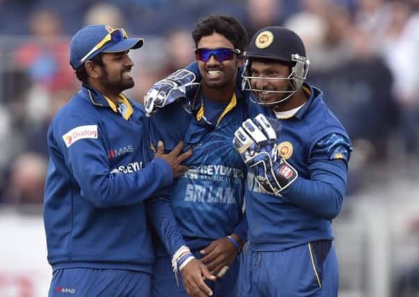 Sri Lanka's Sachithra Senanayake (centre) celebrates the wicket of England's Ravi Bopara during the second ODI at the Emirates ICG, Durham.