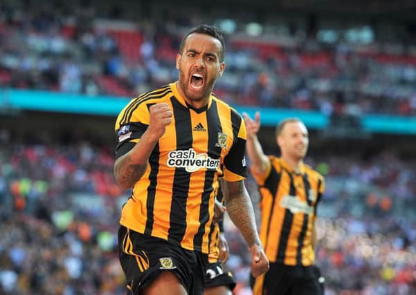 Hull City's Tom Huddlestone celebrates scoring their third goal of the game during the FA Cup Semi Final match at Wembley Stadium, London.