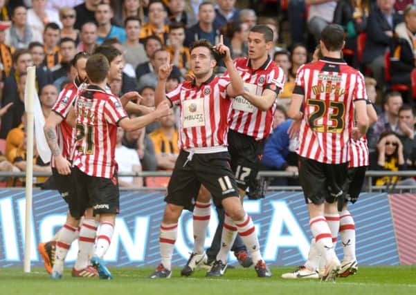Sheffield United's Jose Baxter (centre) celebrates scoring their first goal of the game during the FA Cup Semi Final match at Wembley Stadium, London.