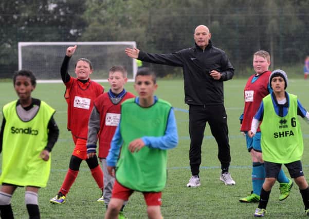 Referee Howard Webb in action. Picture by Steve Riding