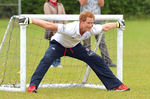 Prince Harry prepares to stop a penalty. Photo credit - John Stillwell/PA Wire