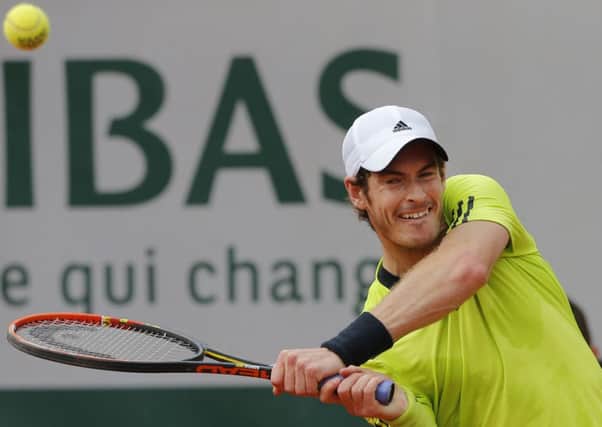 Andy Murray returns in his second round match against Australia's Marinko Matosevic.