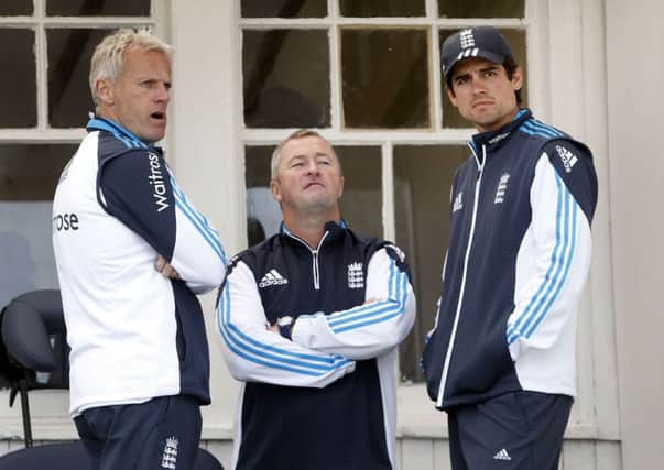 England captain Alastair Cook, right, with head coach Peter Moores, left, and assistant coach Paul Farbrace.