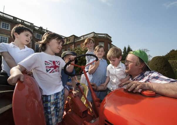 Youngsters take a look at a tractor outside Newby Hall. (S)