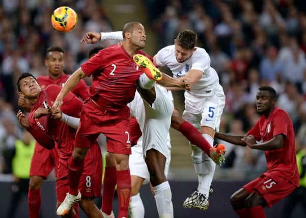 Gary Cahill scores England's second goal during their 3-0 win over Peru at Wembley last night (Picture: Andrew Matthews/PA Wire).