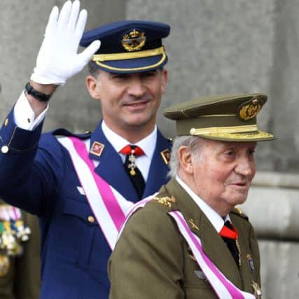 Spain's King Juan Carlos, right, and Crown Prince Felipe