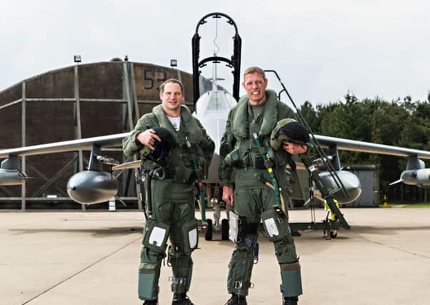 French Air Force pilot Commadant Stephane Peubez (left) and Officer Commanding II (Army-Co-Operation) Squadron, Wing Commander Jez Holmes (right) in front of the Tornado they flew over the D-Day beaches