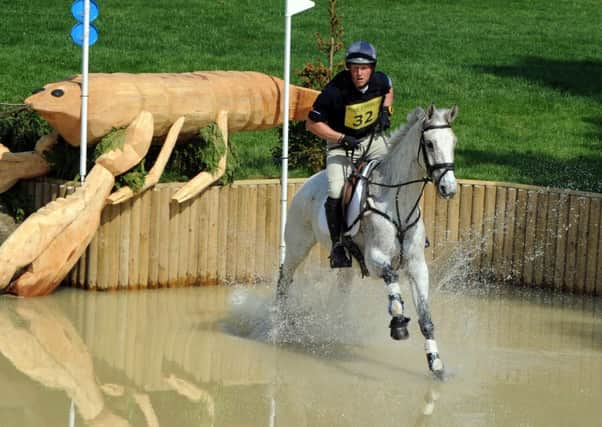 Oliver Townend riding Neo DU Breuil takes on the  Dickinson Dees Beachside water jumps at Bramham