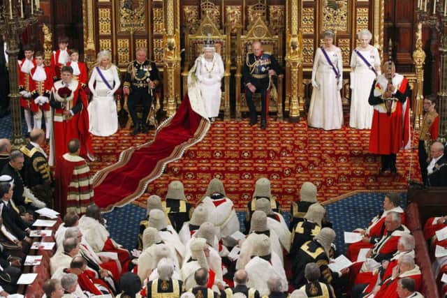 The Queen prepares to deliver her speech in the House of Lords during the State Opening of Parliament
