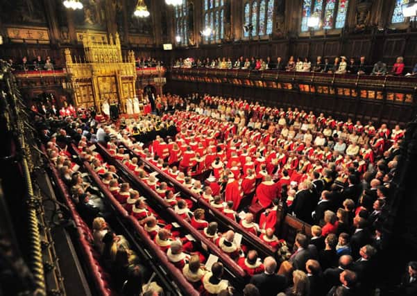The Queen prepares to deliver her speech in the House of Lords during the State Opening of Parliament
