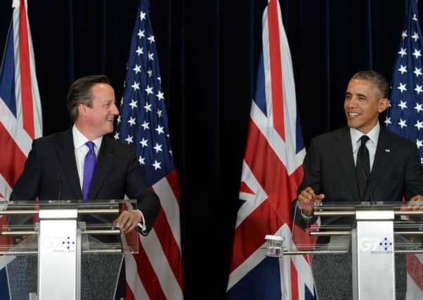 David Cameron holds a press conference with President Obama during the G7 Summit