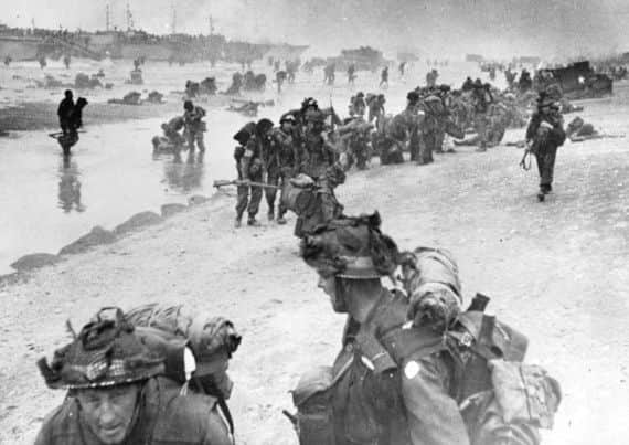 D-Day June 1944 Sword beach. Scarborough man Roy Walker at front left.