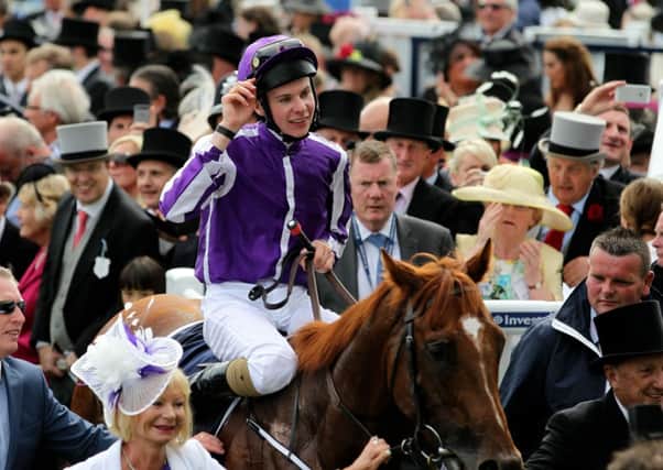 Joseph O'Brien acknowledges the crowd after his victory on Australia.