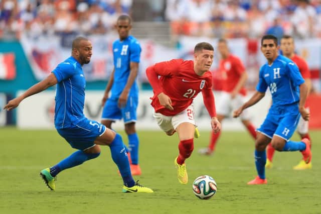 England's Ross Barkley (centre) goes down under a challenge from Honduras' Víctor Bernardez on Saturday night.